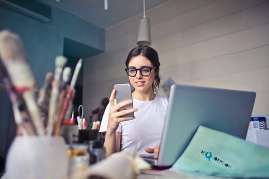 smiling girl checking phone